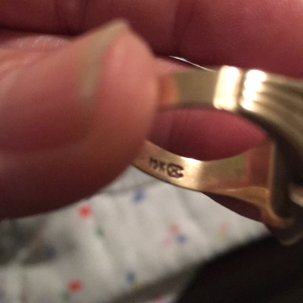 The is.  A. Black. Stone.  Is 10k   Yellow Gold